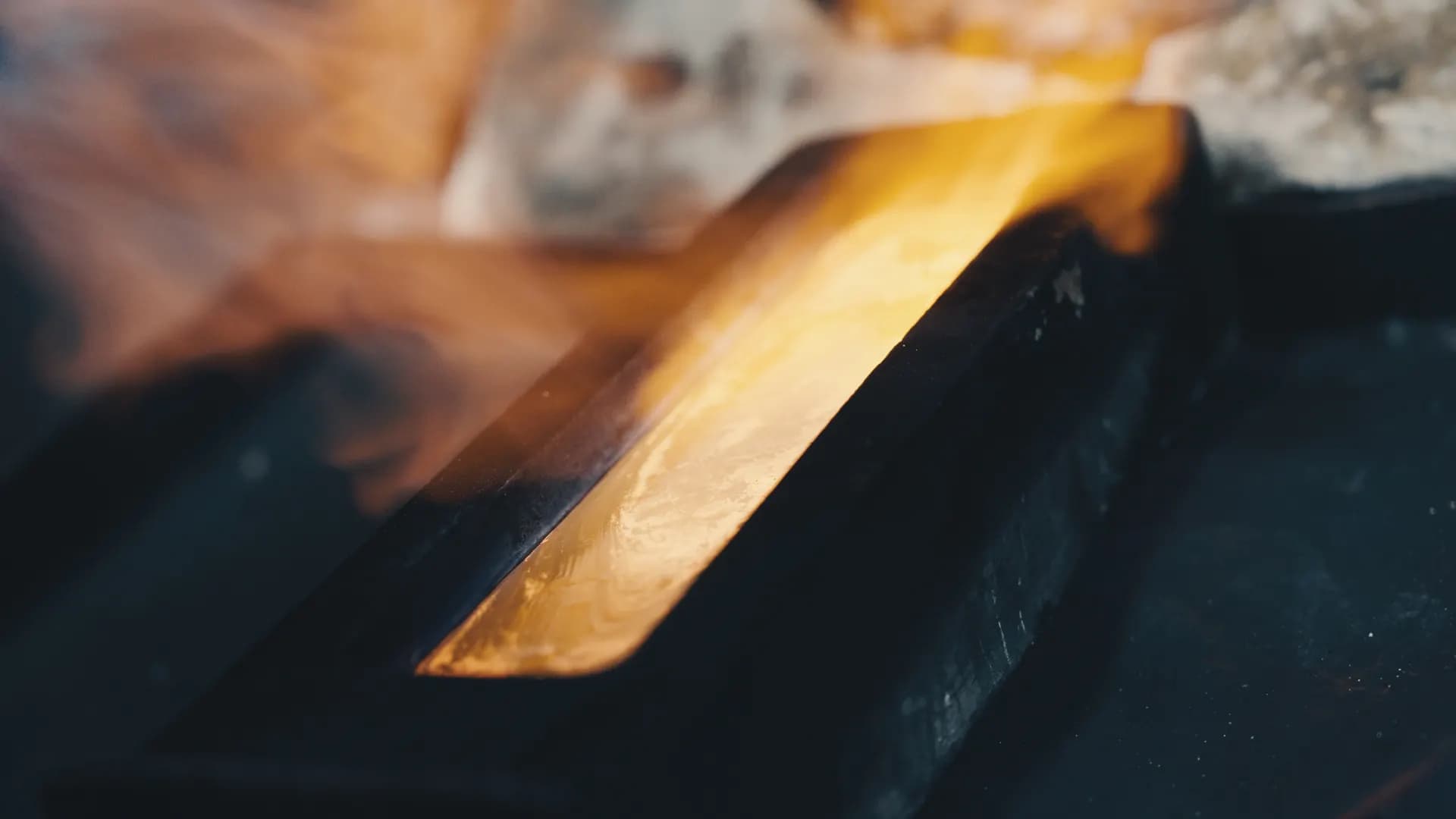 Glowing Lebanor gold bar cooling in its mould